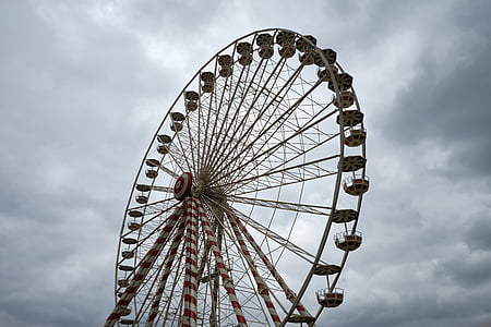 Ferris wheel ride under gray clouds at daytime thumbnail