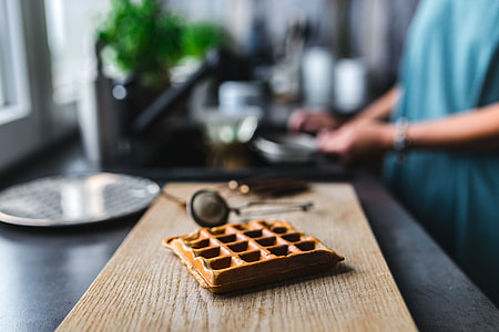 Breakfast waffles with fresh raspberries and powdered sugar thumbnail