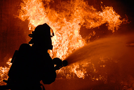 silhouette of fireman putting out fire thumbnail