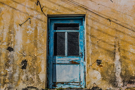 closed blue wooden door thumbnail