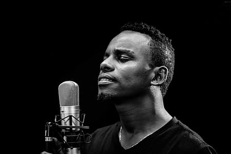 singing man in-front of gray condenser microphone thumbnail