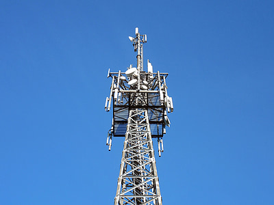 low-angle photography of gray tower under blue sky thumbnail