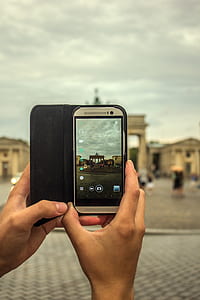 Person Taking Picture Using Gray Smartphone thumbnail