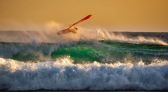person surfing on body of water thumbnail