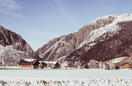 snow-covered mountain and houses thumbnail