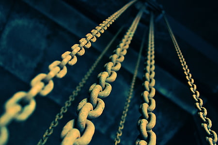 selective focus photography of metal chains thumbnail