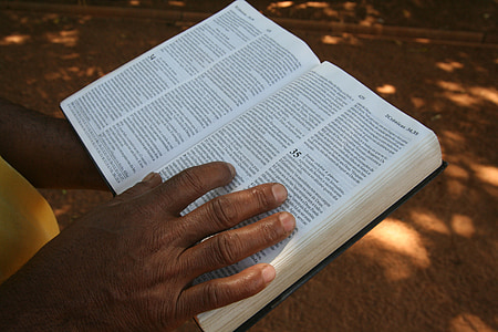 person holding a bible thumbnail