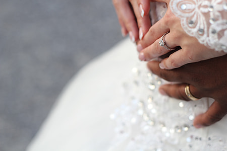 man wearing gold-colored ring and woman wearing silver-colored ring thumbnail