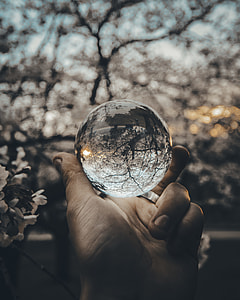 glass ball on person's hand thumbnail