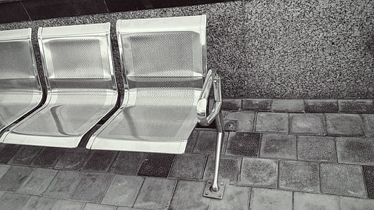 Stainless Steel Bench on Top of Gray Pavement thumbnail