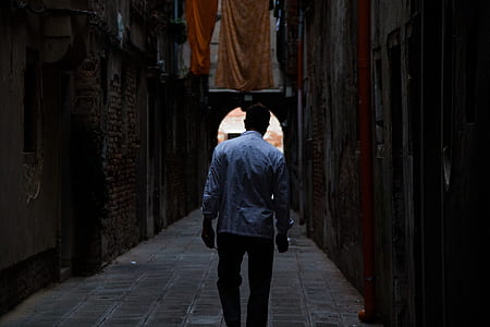 man standing near building structure thumbnail