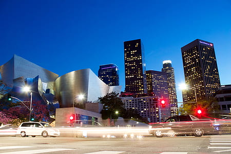 landscape photography of street and city skyline during night time thumbnail