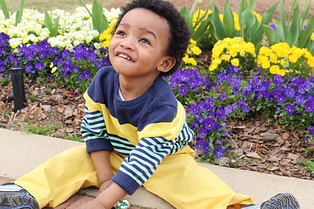 child sitting on ground thumbnail