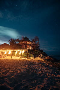 brown wooden canopy tent with lights on beach thumbnail