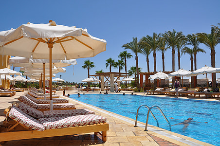 photo of pool with parasol and sun lounge near in resort thumbnail