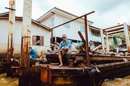 man sitting on flatbed trailer thumbnail