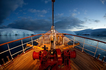 sailing ship sailing near white iceberg thumbnail