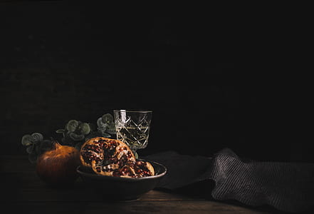 glass goblet on brown wooden table thumbnail