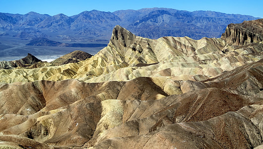 brown mountain under clear sky thumbnail