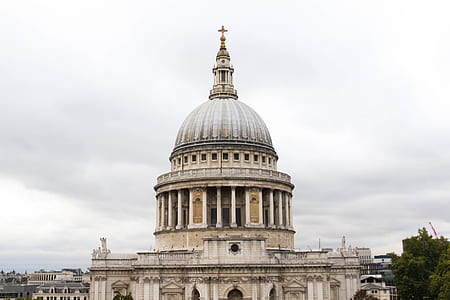 beige concrete cathedral with dome under gray clouds at daytime thumbnail