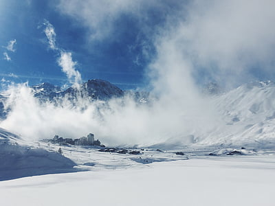 snow-covered mountain under clouds thumbnail