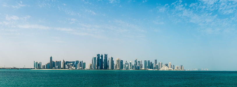 city buildings near body of water thumbnail