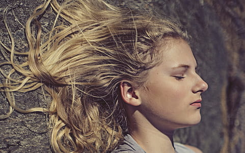 Woman Taking Selfie While Her Eyes Close thumbnail