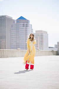 woman standing on concrete rooftop thumbnail