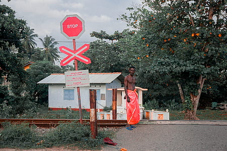 man standing in front of railroad thumbnail