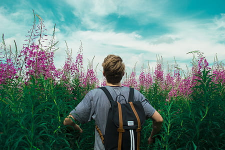 man wearing blue shirt looking into sky thumbnail