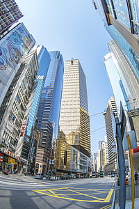 street in middle of buildings during daytime thumbnail