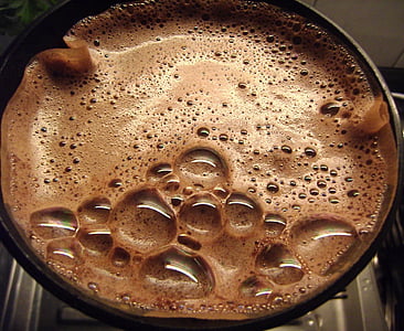 container with brown bubbling liquid thumbnail