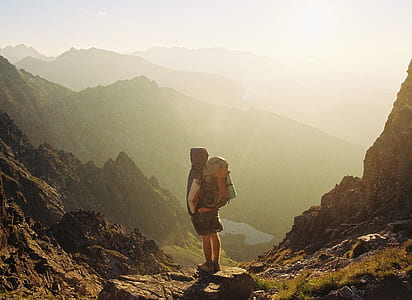 person standing in front of mountain thumbnail