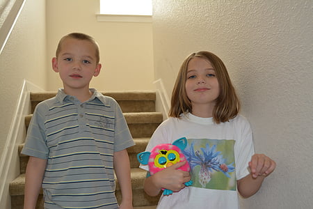 boy and girl standing side by side thumbnail