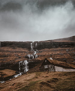 brown hut on mountain thumbnail