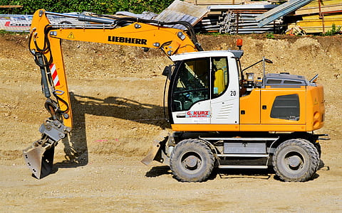 yellow and white excavator thumbnail