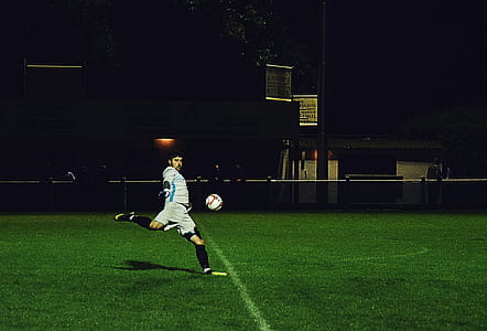 Person Kicks Soccer Ball in Field thumbnail