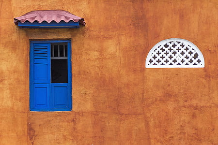 brown painted wall with blue window thumbnail