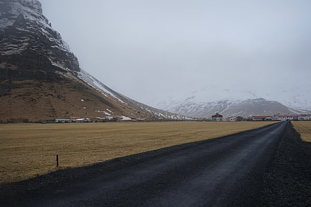 black asphalt road near rocky mountain thumbnail