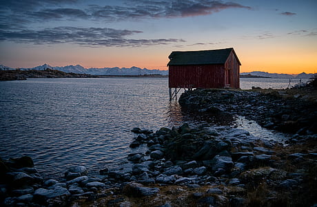 brown house over body of water thumbnail