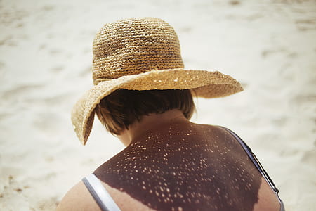 woman wearing brown straw hat thumbnail