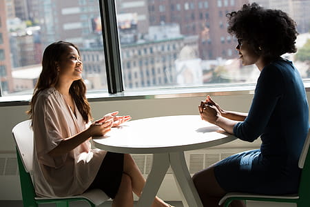 Photography of Women Talking to Each Other thumbnail