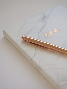 gold pen on Journal book thumbnail