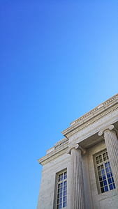 low angle photography of building under blue sky thumbnail