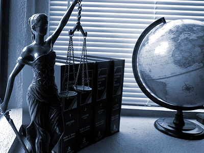 greyscale photo of a desk globe and four book series thumbnail