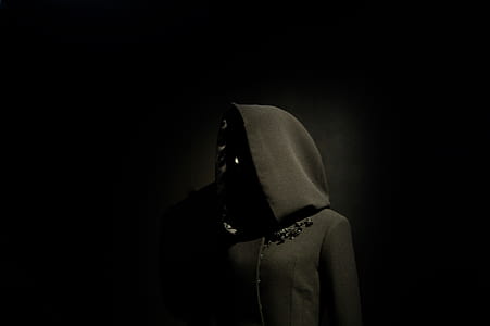 person in black hooded top thumbnail