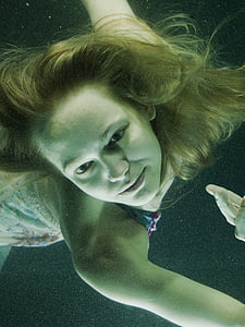woman swimming underwater thumbnail