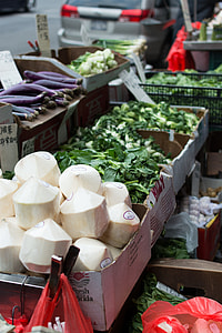 Stall with coconuts and vegetables in Chinatown NYC thumbnail