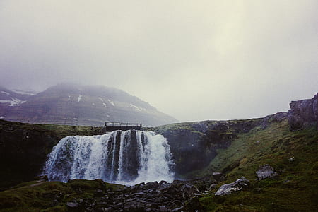 waterfalls near mountain at daytime thumbnail