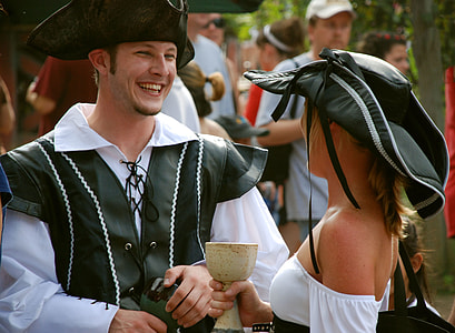 man and woman laughing while facing each other thumbnail